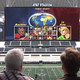 Illustration for article titled Conan OBrien Takes Over A Football Stadiums Screen With Video Games